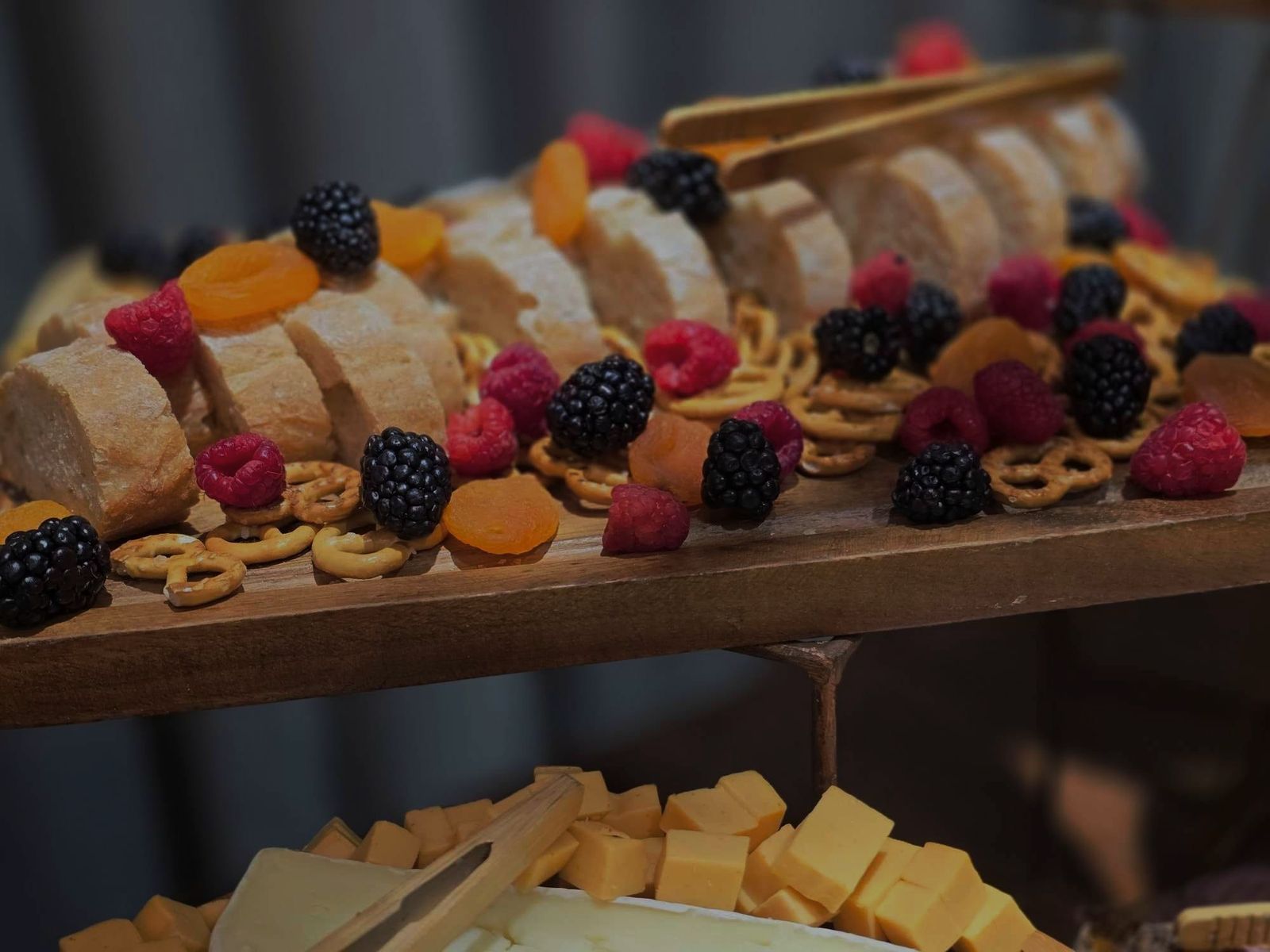Dessert grazing display with fruit and pastry skewers